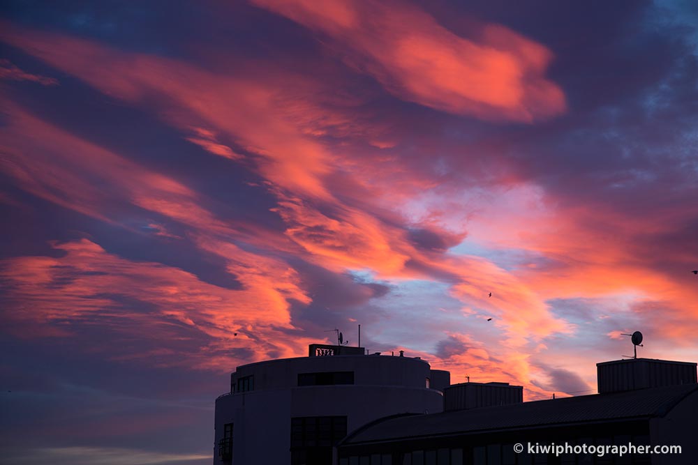 Orange clouds at sunrise over Leith